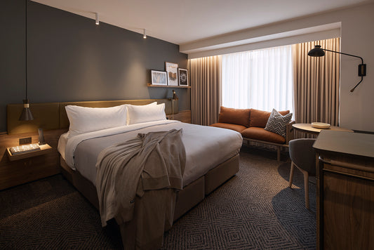 Luxury King Room at Rydges Melbourne for Australian Open Retreat guests, featuring bed, sofa, and desk